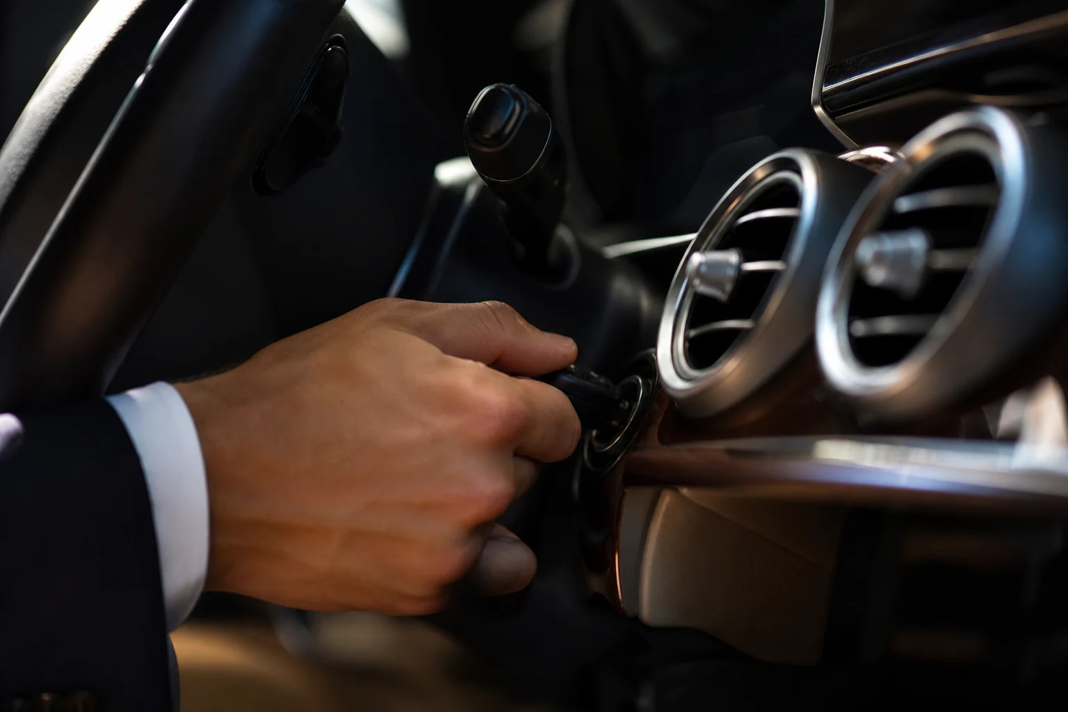 Cinematic shot of a key turning in a luxury car ignition, symbolizing pre-purchase inspection importance